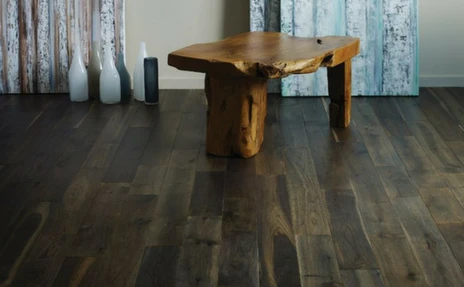 dark hardwood floor with rustic bench